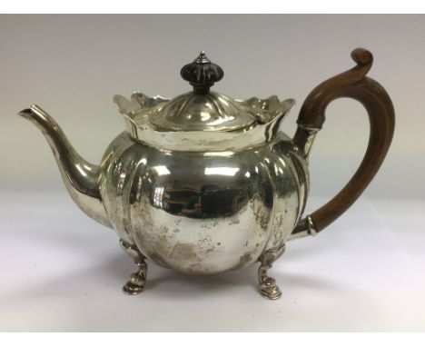 A silver teapot, London hallmarks.