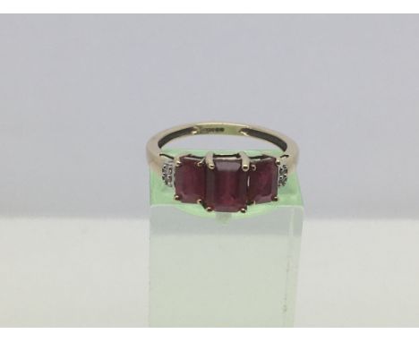 A 9ct gold ring set with three rubies, approx 2.3g and approx size N-O.