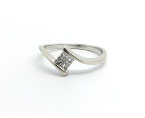 An 18ct white gold ring set with four princess cut diamonds, approx .15ct, apprix 2.5g and approx size M-N.