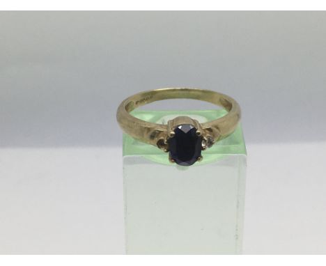 A 9ct gold ring set with a central sapphire, approx 2.5g and approx size O.