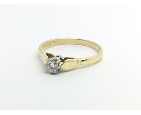 An 18ct gold solitaire diamond ring , approx .15ct, approx 2.3g and approx size L.