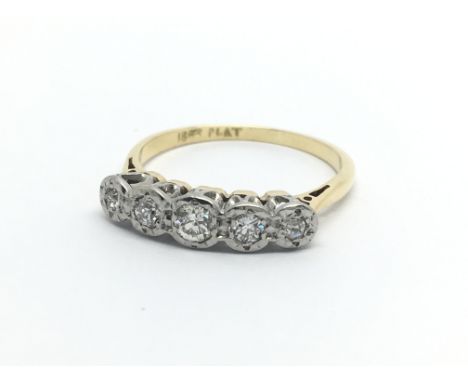 A circa 1950s 18ct gold and platinum ring set with five small diamonds, approx 2.6g and approx size O.