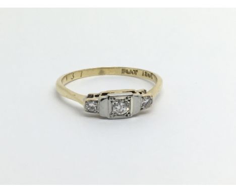 An 18ct gold and platinum three stone diamond ring, approx 1.7g and approx size J.