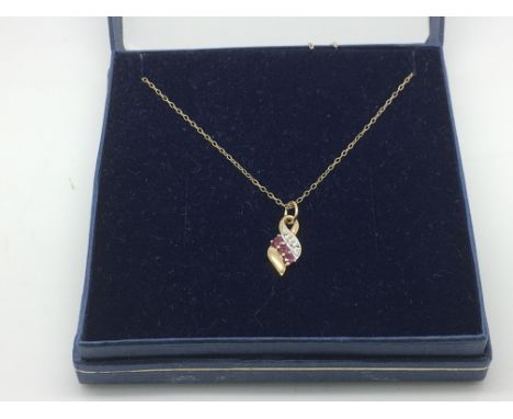 A ruby and diamond pendant on a 9ct gold chain, approx 1.2g.