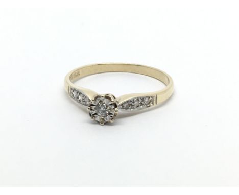 A 9ct gold solitaire diamond ring with further diamonds to the shoulders, approx.10ct, approx 1.6g and approx size P-Q.