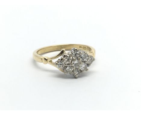 An 18carat gold ring set with a cluster of diamonds ring size K-L