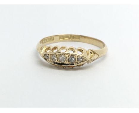 A vintage 18ct gold five stone diamond ring, approx 2.2g and approx size O.