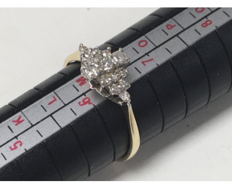 A yellow metal and diamond set ring (N).