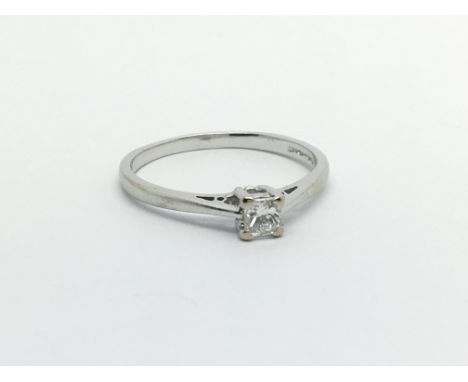 An 18ct white gold solitaire diamond ring set with a princess cut diamond, approx .25ct, approx 2.6g and approx size R.