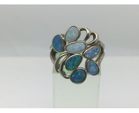 A silver and opal ring, approx size P.