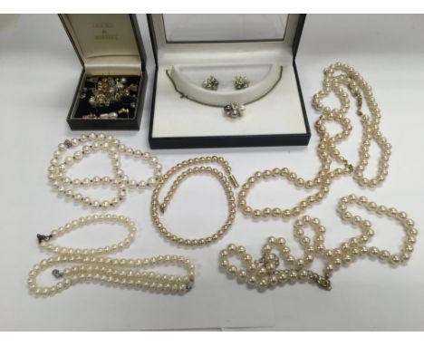 A collection of pearl necklaces, earrings etc.
