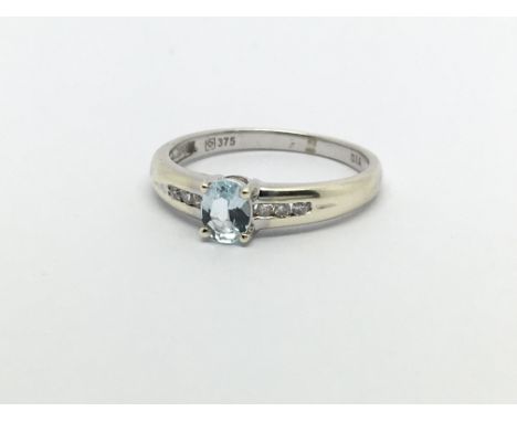 A 9ct white gold ring set with aquamarine and diamonds, approx 1.9g and approx size L.