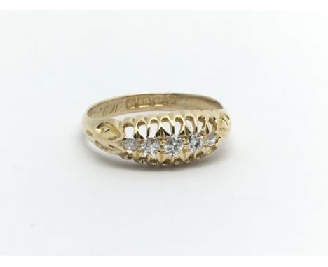 A Vintage 18carat gold ring set with five diamonds Ring size N.