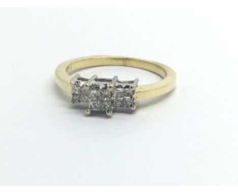 An 18ct gold ring set with twelve princess cut diamonds, approx .25ct, approx 3.1g and approx size K.