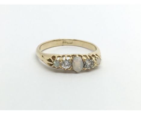 A vintage 18ct gold opal and diamond ring, approx 2.4g and approx size J.