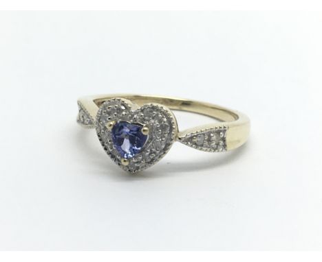 A 9carat gold ring of heart shape set with a tanzanite and small diamonds ring size R.