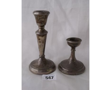 A circular candlestick with v shaped stem Birm also   another        