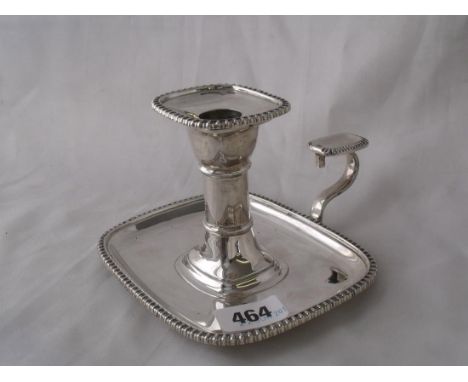 A Georgian style chamber stick with rounded corners   & egg & dart rims 5” over handle Lon 1908 by   Goldsmiths 325g       
