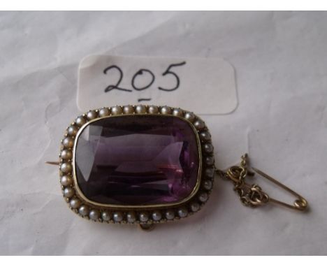 An antique 15ct gold mounted amethyst  and pearl brooch       
