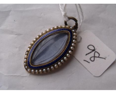 A gold mounted pearl & enamel antique locket   