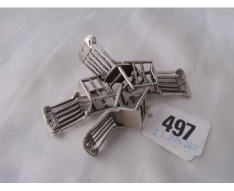 A set four miniature chairs with comb backs  marked sterling 1.5” high  30g     