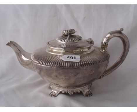 A LATE GEORGIAN CIRCULAR TEAPOT with   reeded shoulders raised on Colette foot 11” over   handle  Lon 1830 by IW & WM  625g  