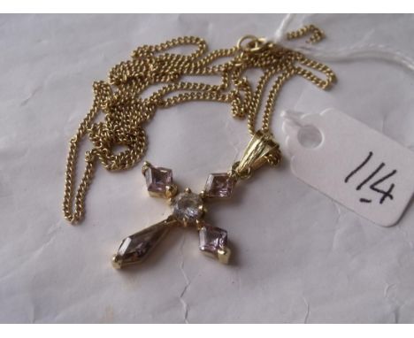 A gold mounted gem set cross on 9ct chain    