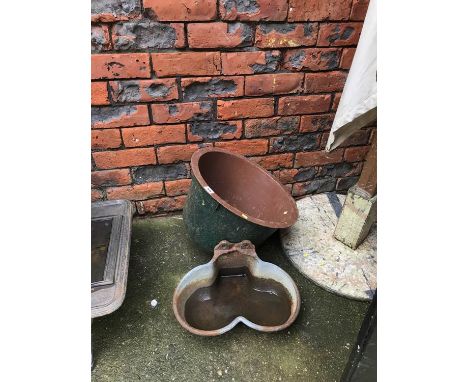 A pig feeder and trough