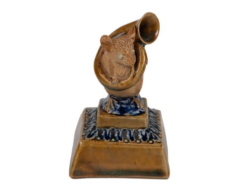 A whimsical figure of a sousaphone playing mouse on a square foliate base. Artist initials impressed.Â&nbsp;Impressed Doulton