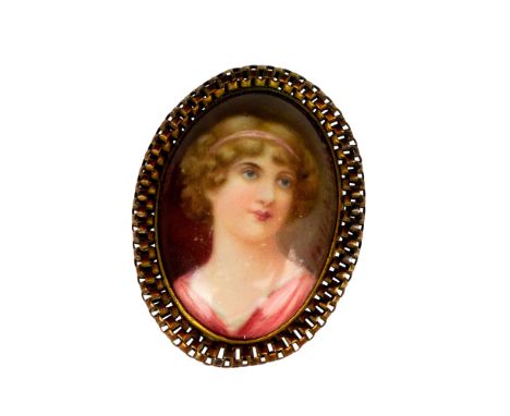 Stunning porcelain brooch with hand painted portrait of woman; gold-toned twisted frame with pin back. Artist signed to back 