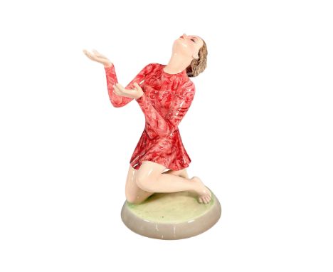 A glazed painted figure of the dancer Mary Wigman (German, 1886-1973) in a floral pink dress. Wigman was the pioneer of expre