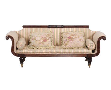  A Regency mahogany sofa,   circa 1815, the shaped rectangular back with turned terminals incorporating carved and fluted dec