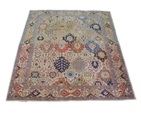  A Tabriz carpet,   of overall design, the polychrome field formed of tesselating palmettes containing fine foliate motifs, w