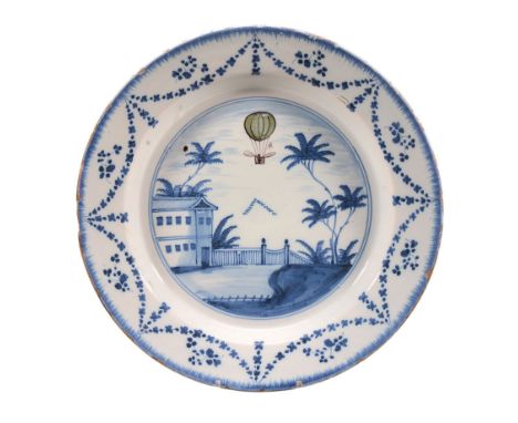  A London delft blue, green and manganese commemorative plate for the balloon ascent of  Vincenzo Lunardi  , circa 1785, the 