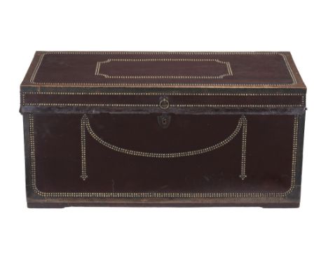  A leather and brass bound camphorwood trunk  , first quarter 19th century, with all over decorative stud work, the lid with 