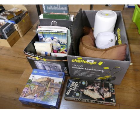 Two boxes of jigsaws, Mastermind game, Scrabble, draught excluder, de-humidifiers etc