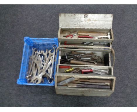 A metal concertina toolbox containing hand tools together with a basket containing ring spanners  