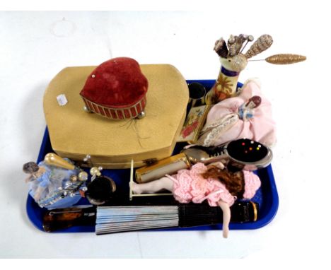 A tray containing cased manicure set, hand fans, plated shoe pin cushion, collection of vintage hat pins, hat pin stands etc 