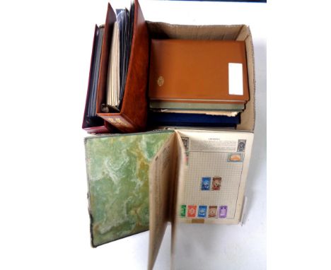 A box of stamp albums, antique and later world stamps, post office first day covers 