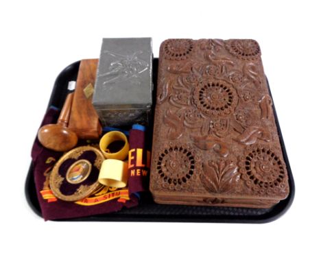 A tray containing carved eastern trinket box, pewter embossed card box, Bakelite napkin rings, portrait miniature Queen Eliza