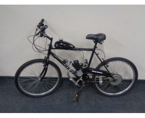 A mountain bike (shimano equipped) fitted with two stroke engine and petrol tank  