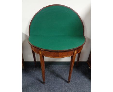 A Victorian inlaid mahogany D-shaped card table  