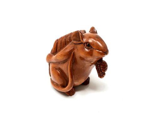 A carved Chinese hardwood netsuke - Rat holding corn