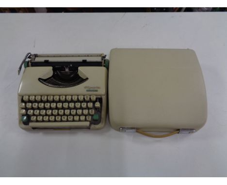 A cased vintage Olympia Splendid 33 typewriter  