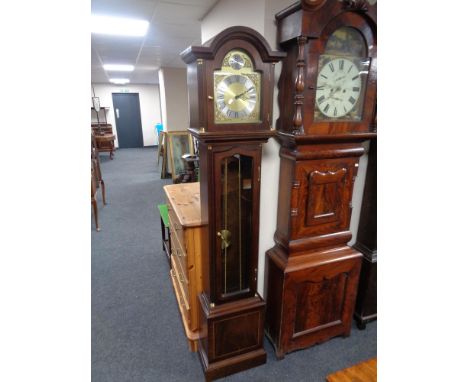 A contemporary longcase clock with brass dial, pendulum and weights 