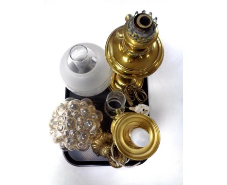 A tray containing two brass oil lamps with chimneys, one with shade, converted, together with a further pendant light fitting