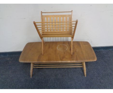 An Ercol elm and beech rectangular coffee table with undershelf together with a folding magazine rack 