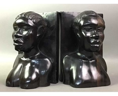 PAIR OF AFRICAN EBONY BOOKENDS AND OTHERS including beadwork head-dress, large wooden ladle and native throwing aid