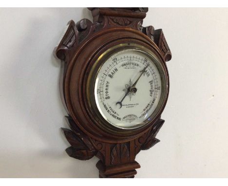 WALNUT BAROMETER EARLY 20TH CENTURY  by Shoolbred &amp; Co, London65cm high