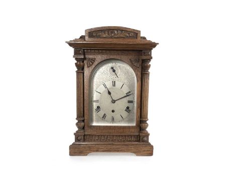 OAK CASED MANTEL CLOCK EARLY 20TH CENTURY the silvered dial with with Roman numerals and subsidiary chime/silent dial, with e